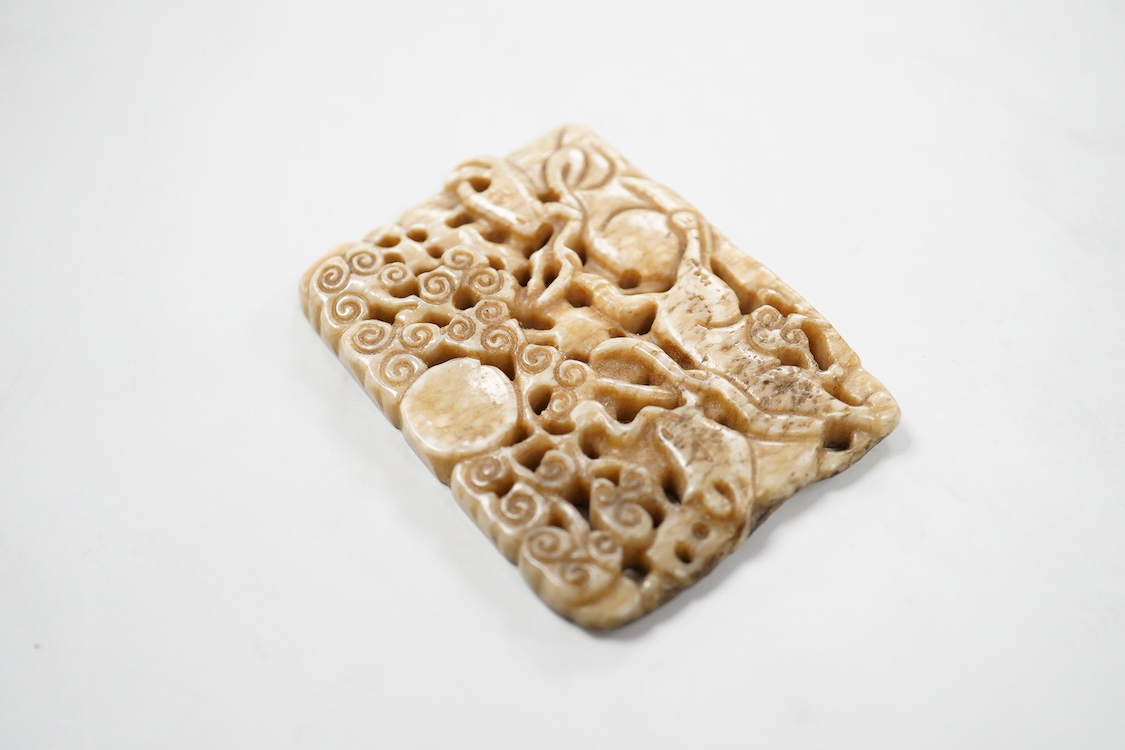A Chinese russet jade rectangular plaque, 7cm wide